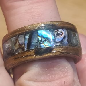 Hand crafted, unique Zebrano bentwood ring with squares of abalone shell set in it.