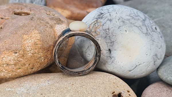 Ebonized oak bentwood ring with a tiny beach pebble set in the top.